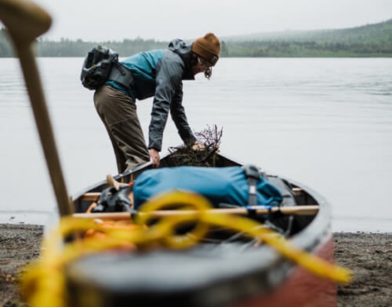 putting canoe in a lake